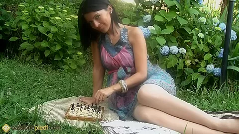 Lovely Barbara playing chess outdoors and flaunting her pantyhosed legs