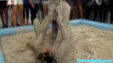 European hotties enjoy wrestling in mud