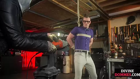 MILF domina dominates over naked male in BDSM session