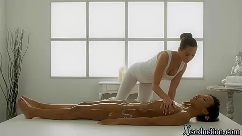 Oiled nubian dyke scissoring and muffdiving at massage