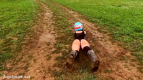 Naked woman riding a Dirt Bike