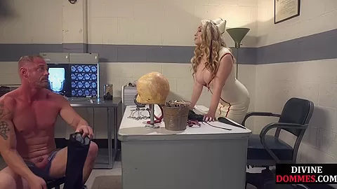 BDSM nurse femina dominates over male in medical room