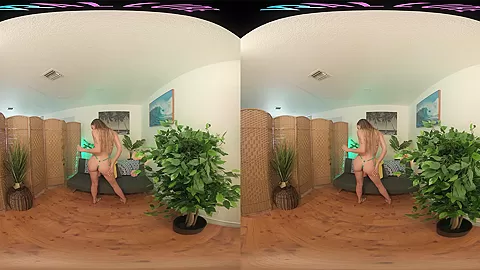 Skinny blonde strips from her bikini and masturbates in VR