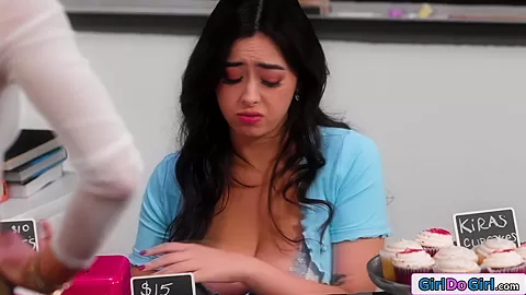 Busty stepmom licks stepdaughter under table during bakesale