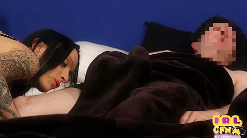 Tattooed CFNM domina sucks and jerks guy cock in the bed
