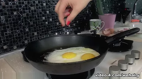 Yana Cey masturbates while cooking in her kitchen