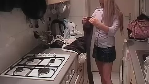 Merry blonde KazBxxx in maid uniform putting on a tampon