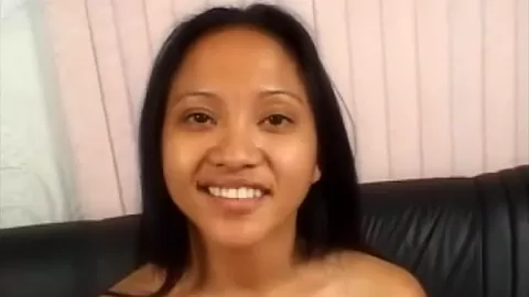 Busty asian babe sucking on cock