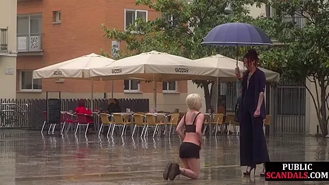 Public slut humiliated on the street by her strict domina