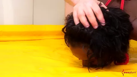 Tied up black slut gets spit on