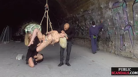 Public spanking of blonde euro babe in ropes getting fucked