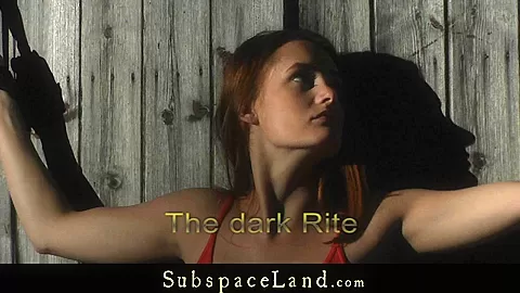 Redhead dominated in a dark rite and spanked