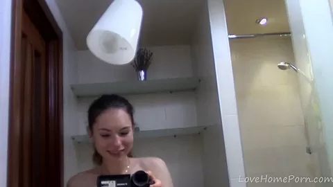 Babe with big natural tits teases while showering