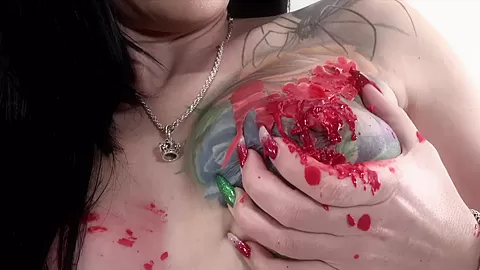 Tattooed babe Marie Bossette covers herself in hot wax