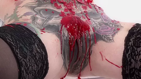 Tattooed babe Marie Bossette covers herself in hot wax
