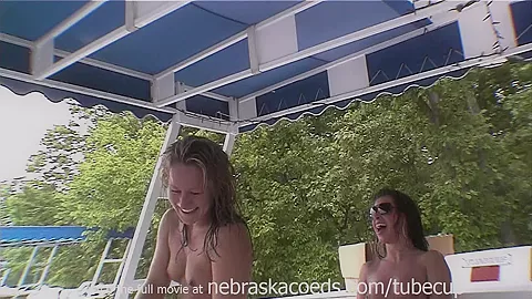 drinking beer out of plastic cocks while partying