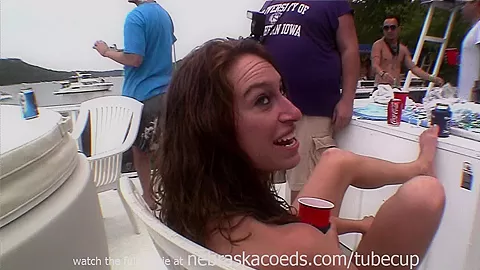 drinking beer out of plastic cocks while partying