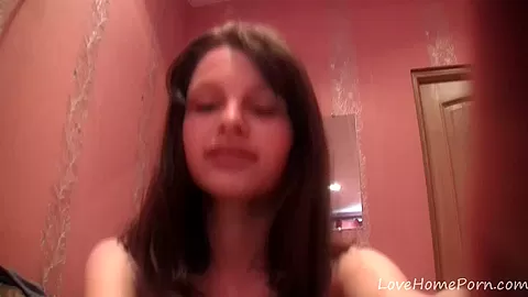 Beautiful brunette takes off her clothes on camera