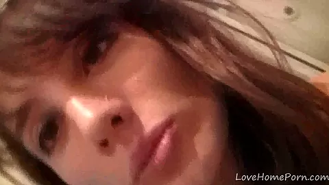 Gorgeous brunette records herself in the bathroom mirror