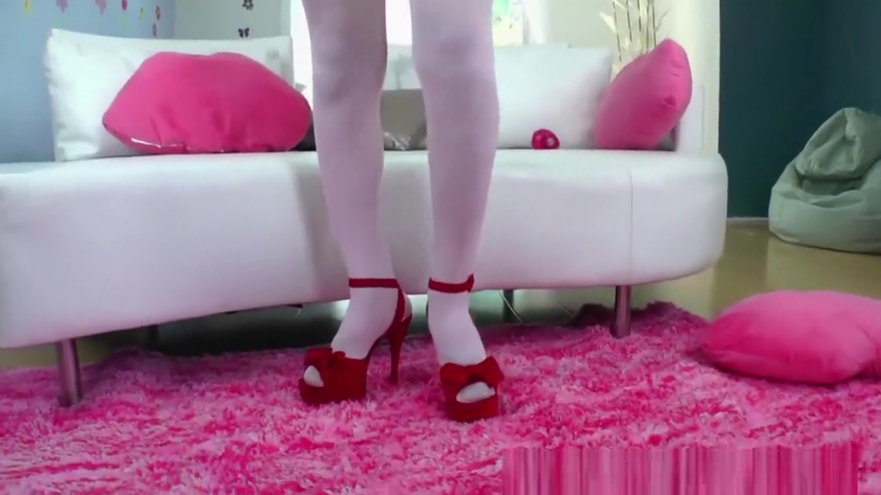 Pretty ladyboy Jane Marie inserts a sex toy into her tight ass