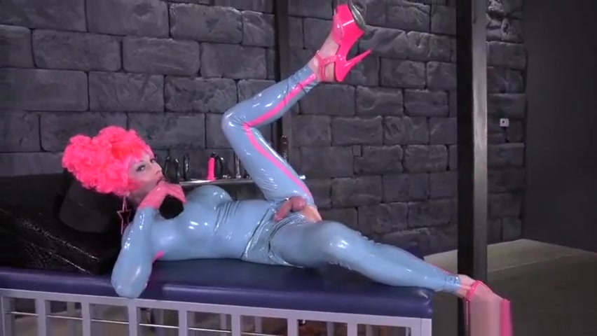 Tara E. Sissy Doll Pegged In Rubber costume