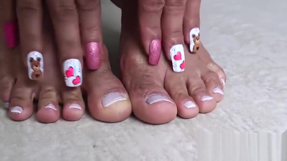 Busty shemale playing with her sexy feet and her huge dick