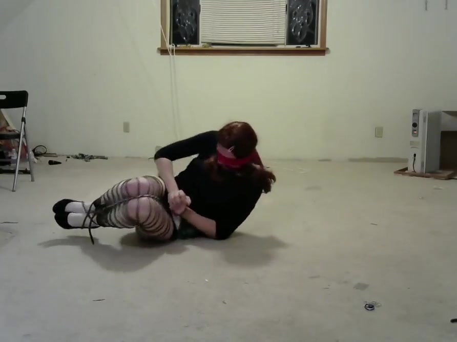 crossdresser in multiple bondage positions 3