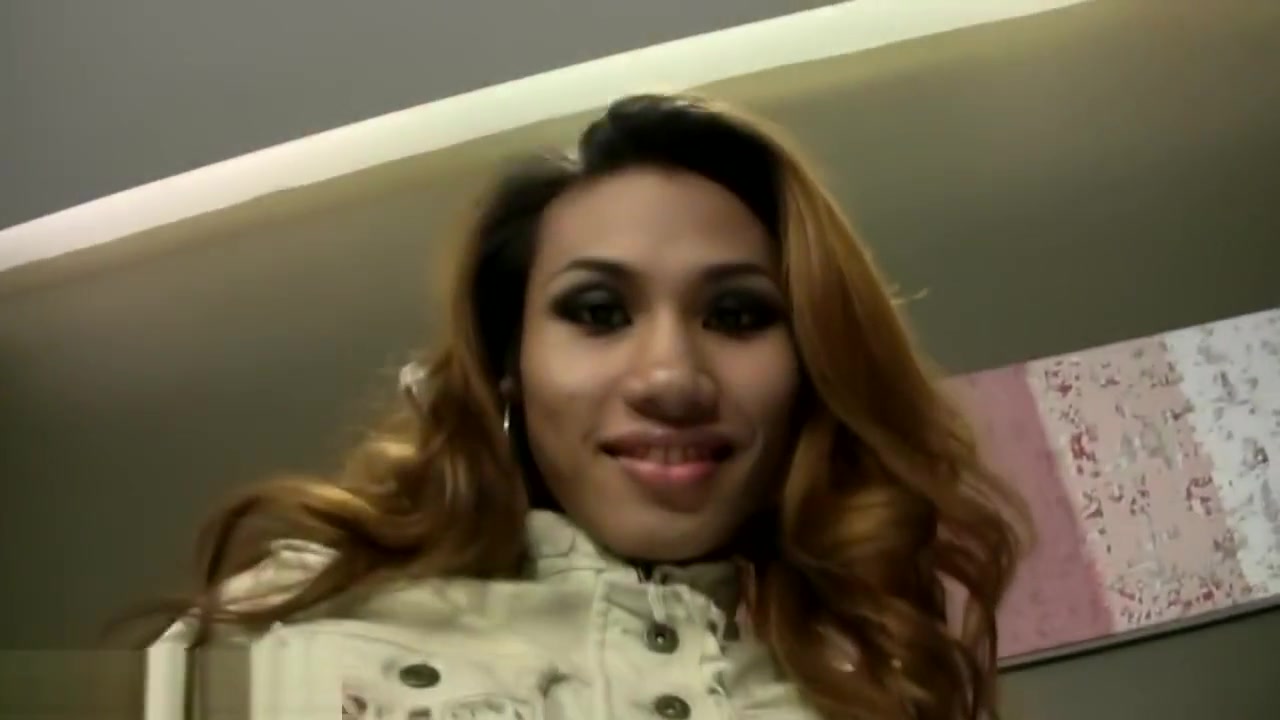 Rafe gets his huge cock sucked by sexy redhead Thai ladyboy
