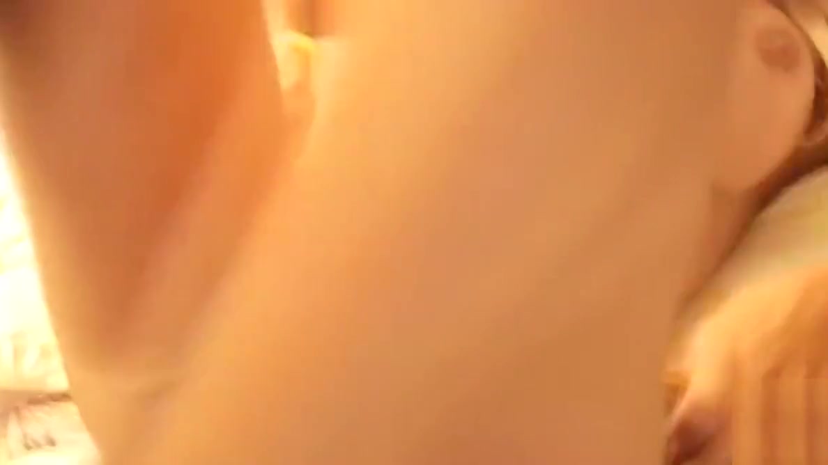 Angeles Cid in a bikini bottom on the bed