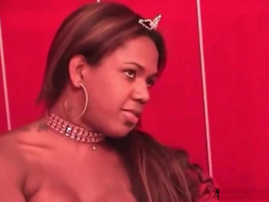 Black chick with dick shows off her fuckable ass and shecock