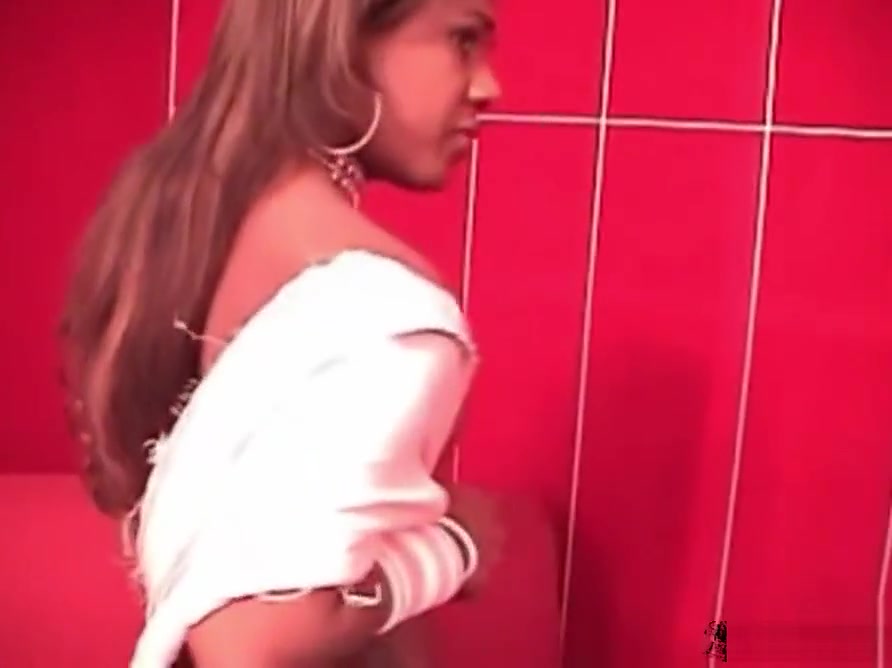 Black chick with dick shows off her fuckable ass and shecock