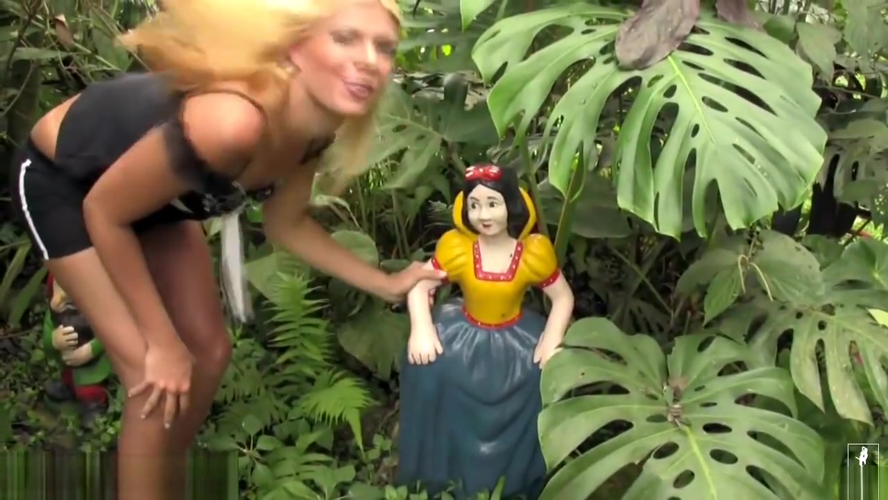Naughty blonde shemale exposes tiny tits and penis outdoors