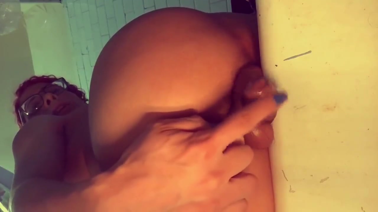 TS shows off her cock from the back