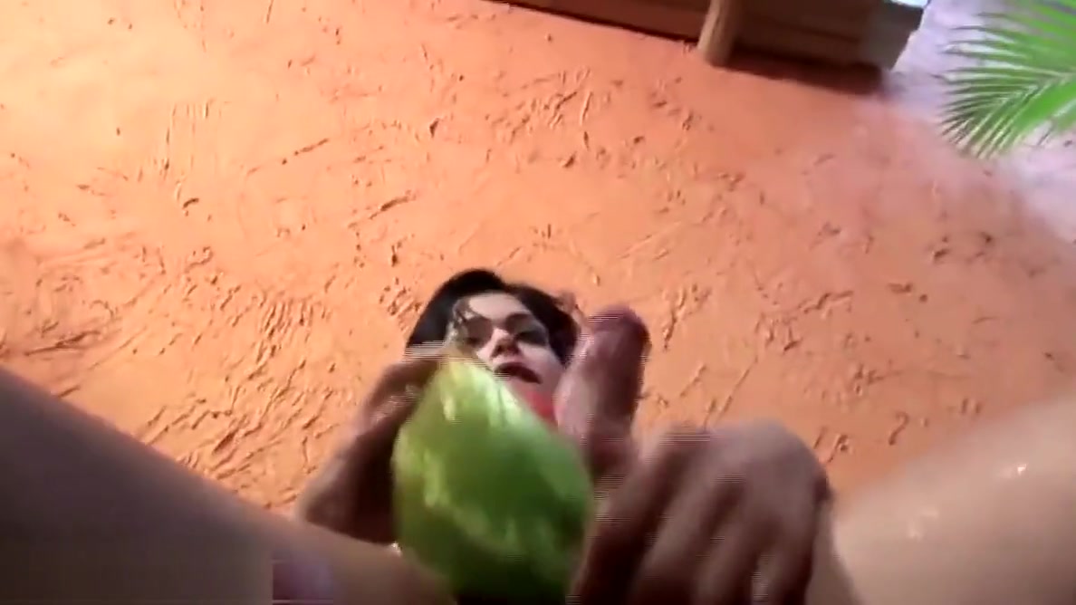 Slim tranny is riding watermelon glory hole and cums inside