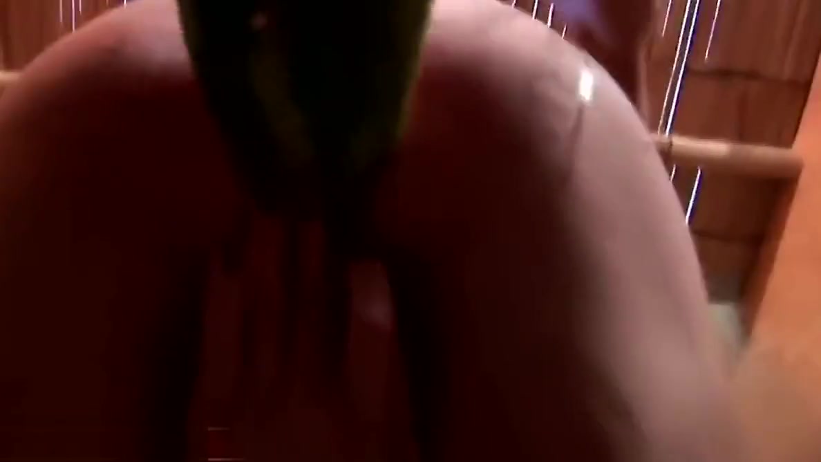Slim tranny is riding watermelon glory hole and cums inside