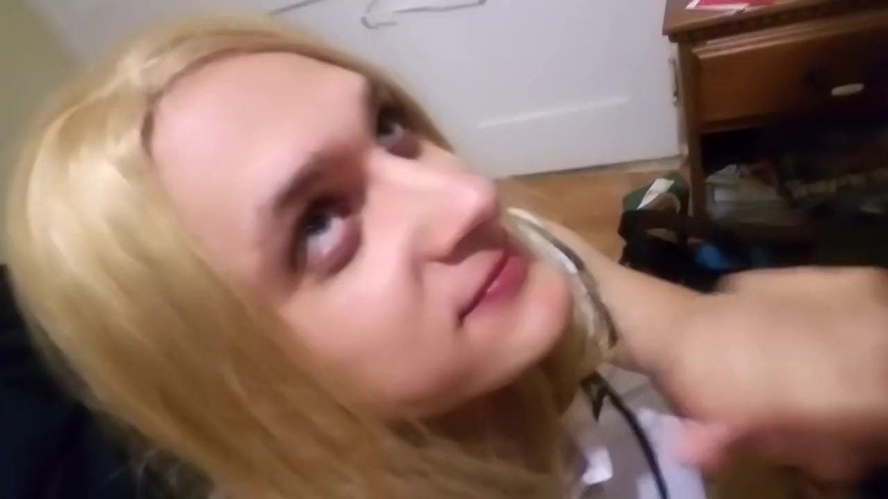 Sissy in chastity sucking cock