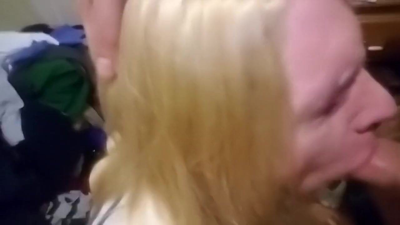 Sissy in chastity sucking cock