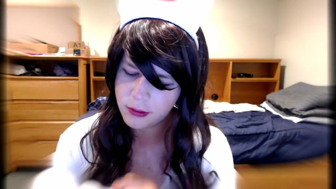 Cute Crossdresser Nurse Blows Dildo