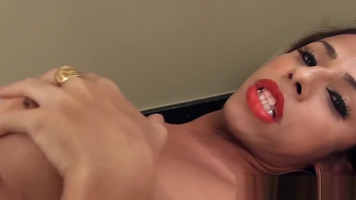 Busty trans babe masturbating on the table