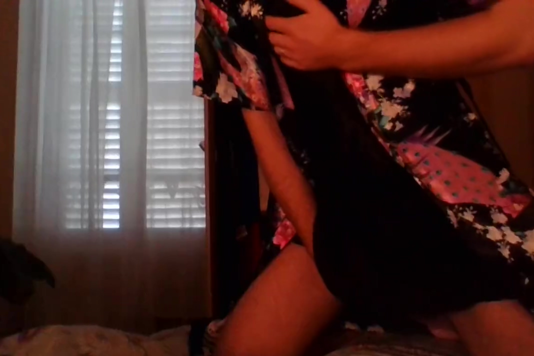 Crossdresser wearing satin robe masturbating and ejaculating all over satin