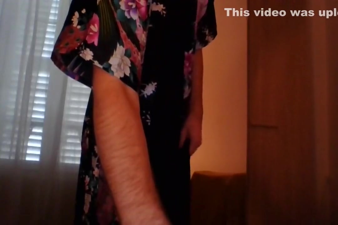 Crossdresser wearing satin robe masturbating and ejaculating all over satin