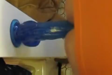 Chastity tranny fucks 9 inch wall dildo