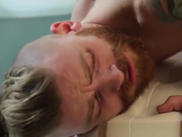 Bearded hunk receives a thick bareback probing from a tranny