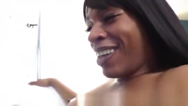 Ebony shemale rubs her dick at home
