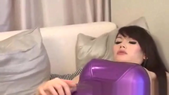 Sexy oriental shemale climaxes on her body