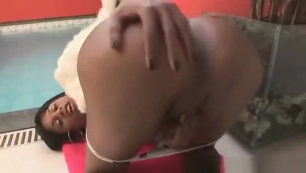 Ebony shemale jerking her hard cock poolside