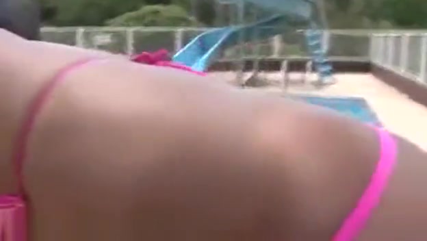 Latina Ts doll shows her tool by a pool