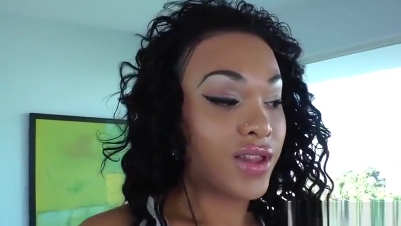 Ebony shemale shows her big pierced cock