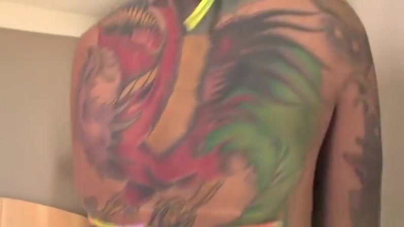 A tanned transsexual in bikini loves to masturbate