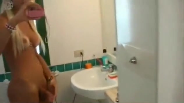 Pleasant blonde films herself and plays with her huge cock